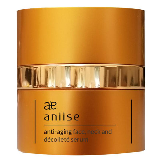 Aniise anti-aging face, neck, and decolletè serum jar with gold lid on a white background