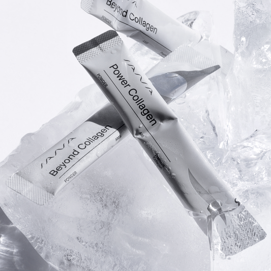 Power Collagen syringe and packets on a textured white background