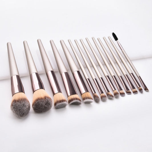 Set of makeup brushes with varying bristle sizes on a white background