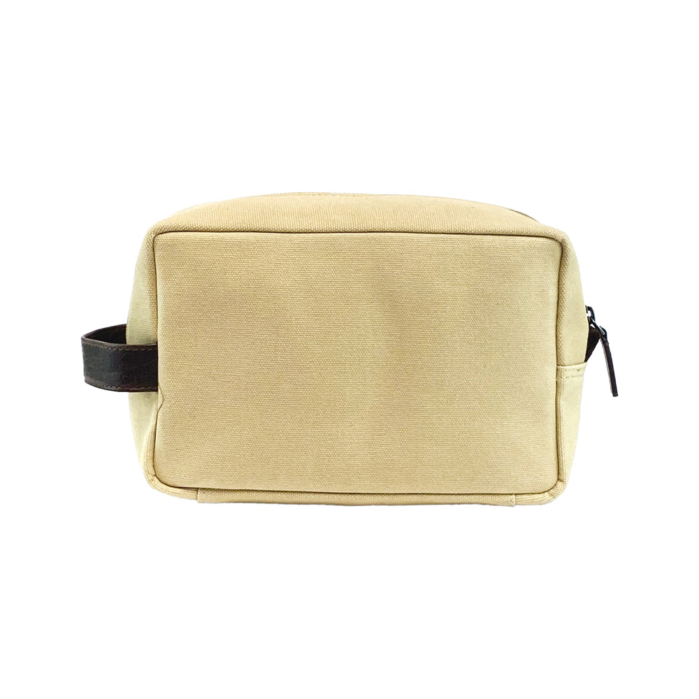 Beige toiletry bag with black zipper and strap on a white background
