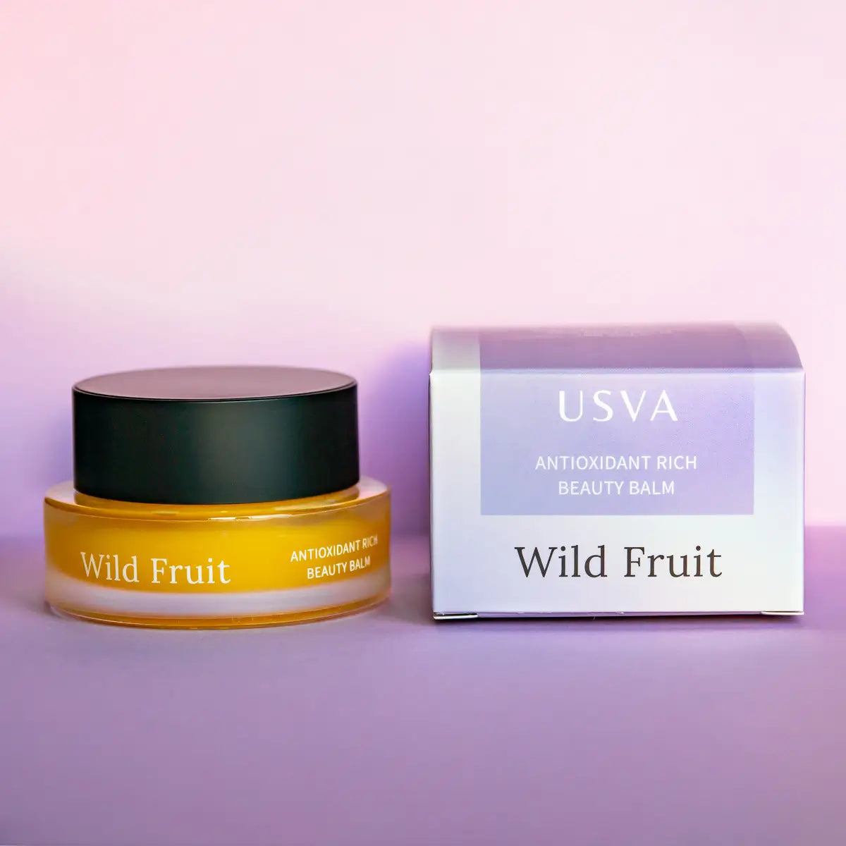 USVA Wild Fruit Antioxidant Rich Beauty Balm with packaging on a purple background