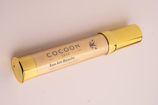 Gold tube of Cocoon Skin product on a light background