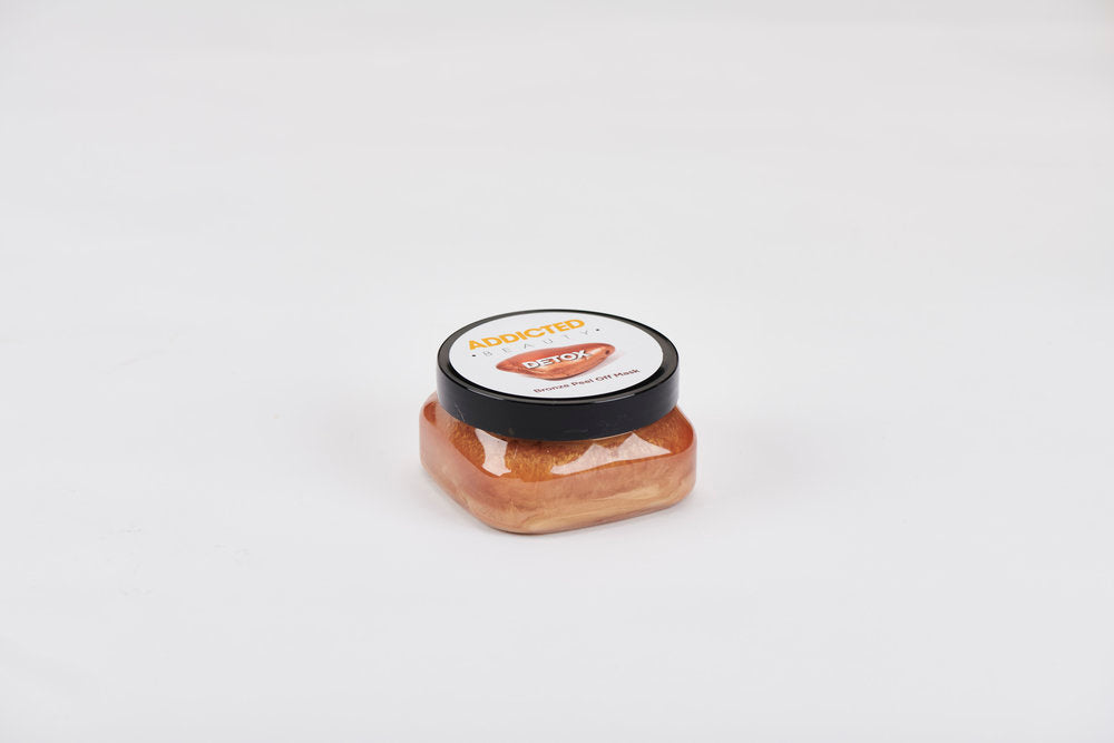 Small jar with a black lid on a white background
