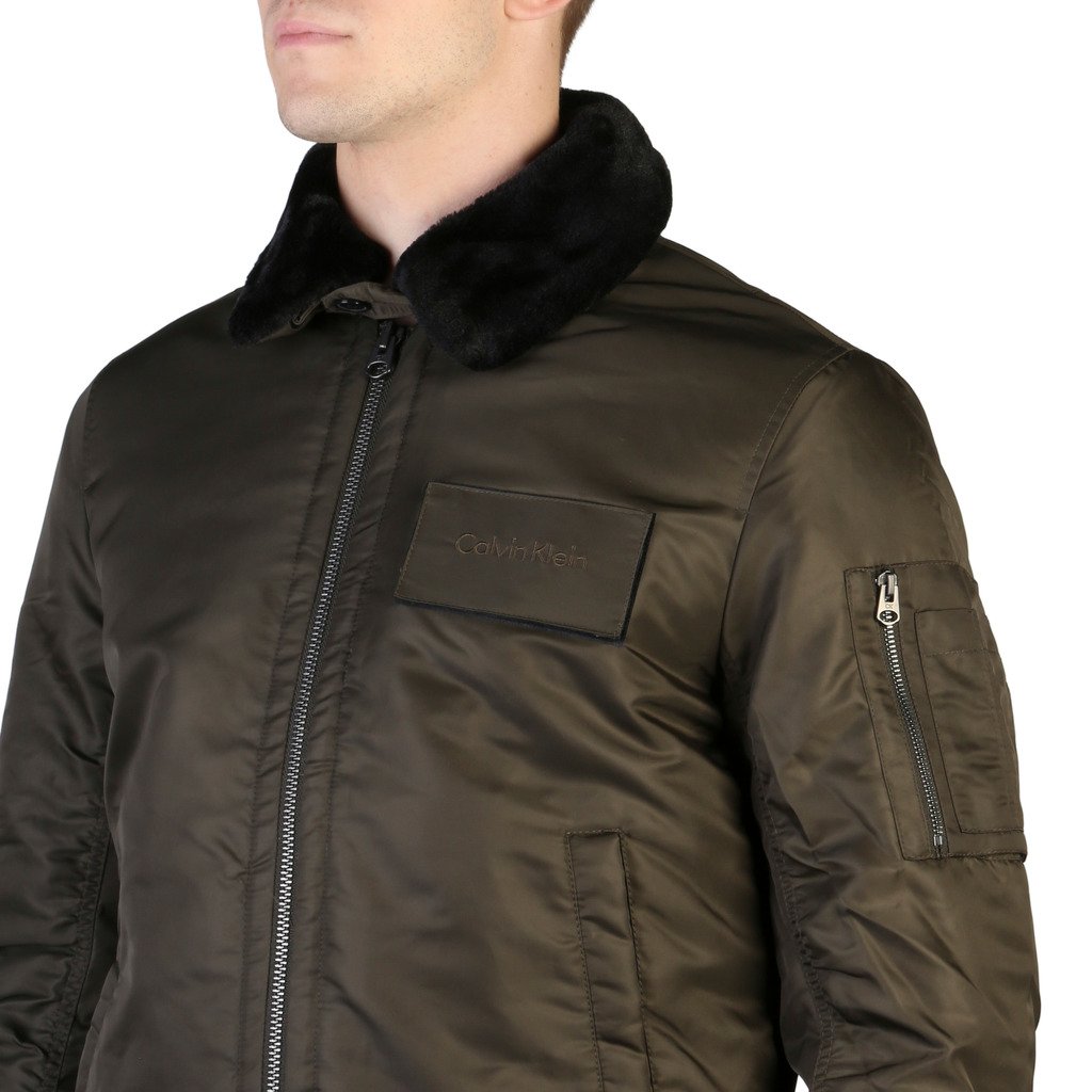 Brown jacket with fur collar and Columbia logo on a white background