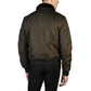 Man wearing a dark green bomber jacket on a white background
